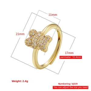 Detailed view of adjustable gold butterfly ring with sparkling cubic zirconia micro-pave