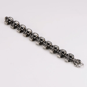 Macro shot of gothic skull bracelet in vintage silver stainless steel with matte finish