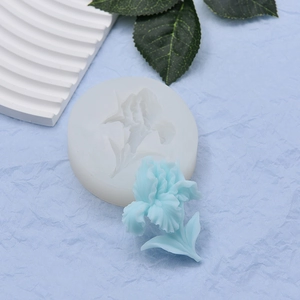 Macro detail of iris flower silicone mold with 3D floral resin casting on blue background
