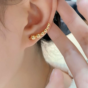 Minimalist 925 sterling silver curved gold bead crawler earrings with a glossy mirror finish