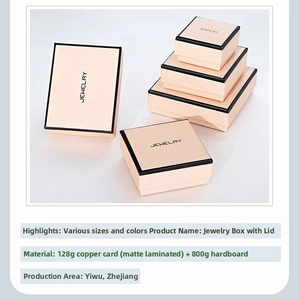 Macro shot of pink cardboard jewelry boxes with elegant black trim and matte finish