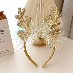 Detail of Christmas reindeer antler headband with gold sequins and colorful long tassels