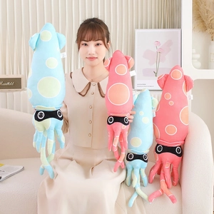 Detailed plush squid toys in blue and pink colors held by a model in a cozy home setting