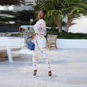 Women long sleeve jumpsuit featuring artistic blue and orange print with a high neck design