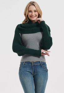 Detail of dark green knitted shawl scarf with sleeves shown on a professional model