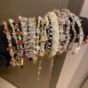 Elegant rhinestone and pearl floral headbands with colorful crystal embellishments