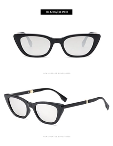 Detail view of foldable black cat-eye sunglasses with premium silver metal hinges