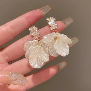 Elegant floral drop earrings with shell-like white petals and sparkling crystals for women