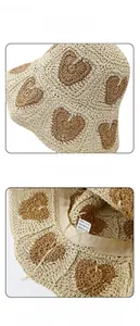 Detail of beige straw hat featuring woven heart patterns and adjustable inner sweatband