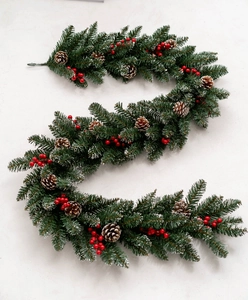 Detail of luxury PE mixed Christmas garland with green pine needles, red berries and cones