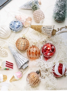 Detailed view of assorted Christmas ornaments with glitter, pearls and unique shapes