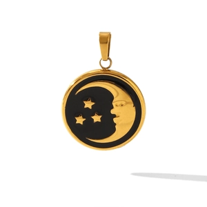 Close-up of a round 18K gold pendant with black enamel moon face and stars detail