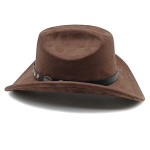 Detail of dark brown suede cowboy hat with leather band and bull head metal emblems