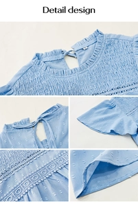 Detail view of light blue blouse with textured dots, smocking, and delicate lace trim