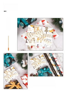 Close-up of assorted Christmas gift wrapping paper rolls with festive ribbons and pine cones