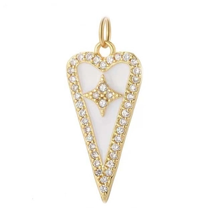 Macro shot of gold heart pendant with inlaid white enamel and sparkling zircon accents