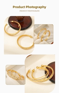 Macro shot of 18K gold plated hoop earrings with micro-pave cubic zirconia settings