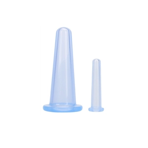 Detail view of blue silicone facial cupping massage cups in two different sizes