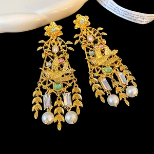 Vintage gold earrings with diamond-encrusted resin flowers, birds and pearls