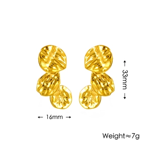 Textured irregular gold petal earrings featuring a hammered finish and 33mm height