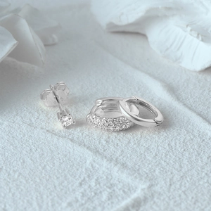 Macro shot of 925 sterling silver earring set with detailed S925 hallmark and sparkling zircon