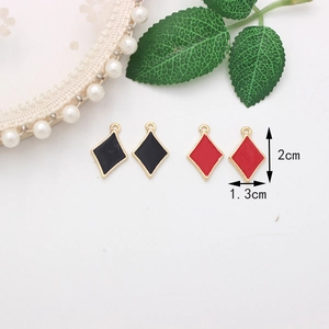 Detailed size view of red and black diamond drip oil charms with golden plating edge