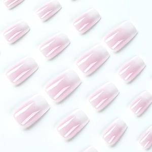 Glossy white French ombré press-on nails with squoval shape and gradient jelly texture