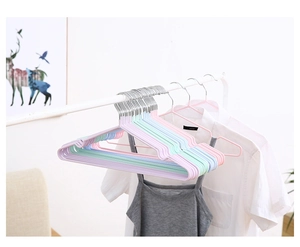 Detail showing anti-slip coating and shoulder notches on colorful macaron hangers