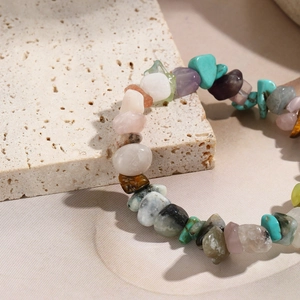 Detailed close-up of Bohemian stretch bracelet with colorful natural polished stone beads