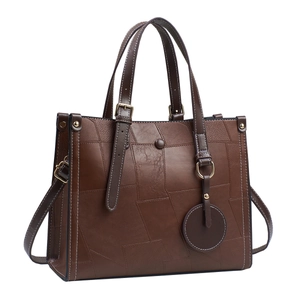 Retro dark brown patchwork leather tote bag with top handles and adjustable strap
