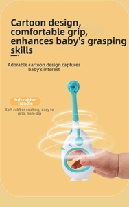 Detail of penguin-shaped toddler toothbrush with anti-slip soft rubber ring handle