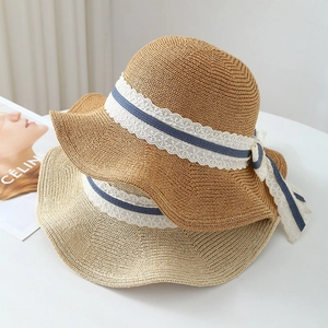 Women's summer straw sun hat with breathable weave, elegant lace trim and ribbon detail