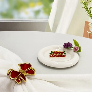 Christmas bow napkin ring with Merry Christmas brooch and red enamel detail