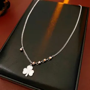 Silver beaded chain necklace featuring a clover heart pendant with 520 engraving on leather