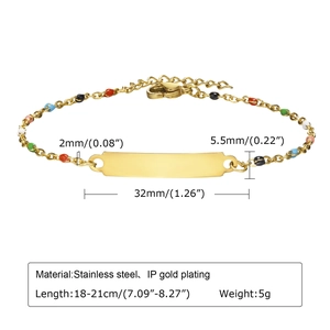 Detailed view of golden stainless steel cross bracelet with size specs and colorful beads