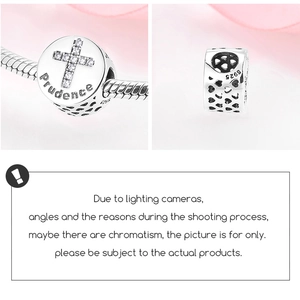 Macro detail of S925 sterling silver Prudence bead with zircon cross and engraved text