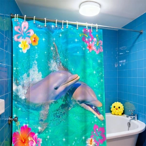 Waterproof ocean shower curtain featuring dolphins and tropical flowers in blue bathroom
