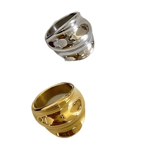 Polished wavy stainless steel rings in gold and silver finishes, minimalist bold design
