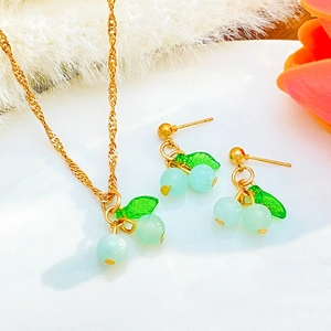 Sweet cherry jewelry set with green translucent beads, gold necklace and stud earrings