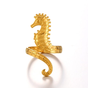Exaggerated golden seahorse shaped fashion ring with textured ocean motif and open design