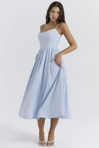 Detail of baby blue backless maxi dress with thin straps and waist pleats