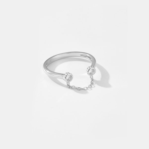 Detailed macro view of S925 sterling silver open ring with chain and zircon pendant