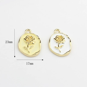 Floral oval pendant charms in beige and white enamel with golden rose relief, 23mm size