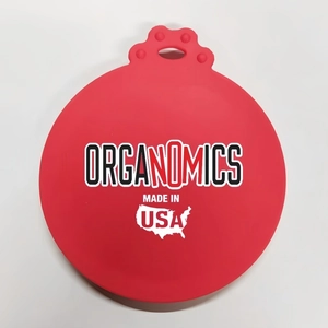 Top-down view of red silicone pet food lid with Organomics branding and matte finish