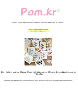 Detailed view of colorful checkered heart-shaped mini hair clips on a display card