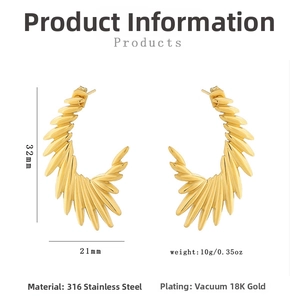 Detail view of gold wing earrings in 316 stainless steel with 32mm x 21mm dimensions