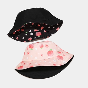 Reversible peach print bucket hat for women in black and pink cotton canvas