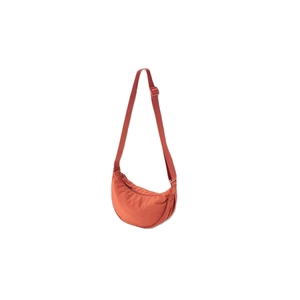 Dark orange nylon half-moon crossbody bag with adjustable strap in a clean studio shot