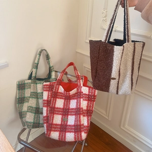 Detailed view of plush leopard and plaid tote bags in green, red, and brown textures