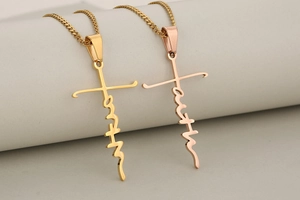 Macro view of gold and rose gold stainless steel faith cross necklaces with lobster clasps